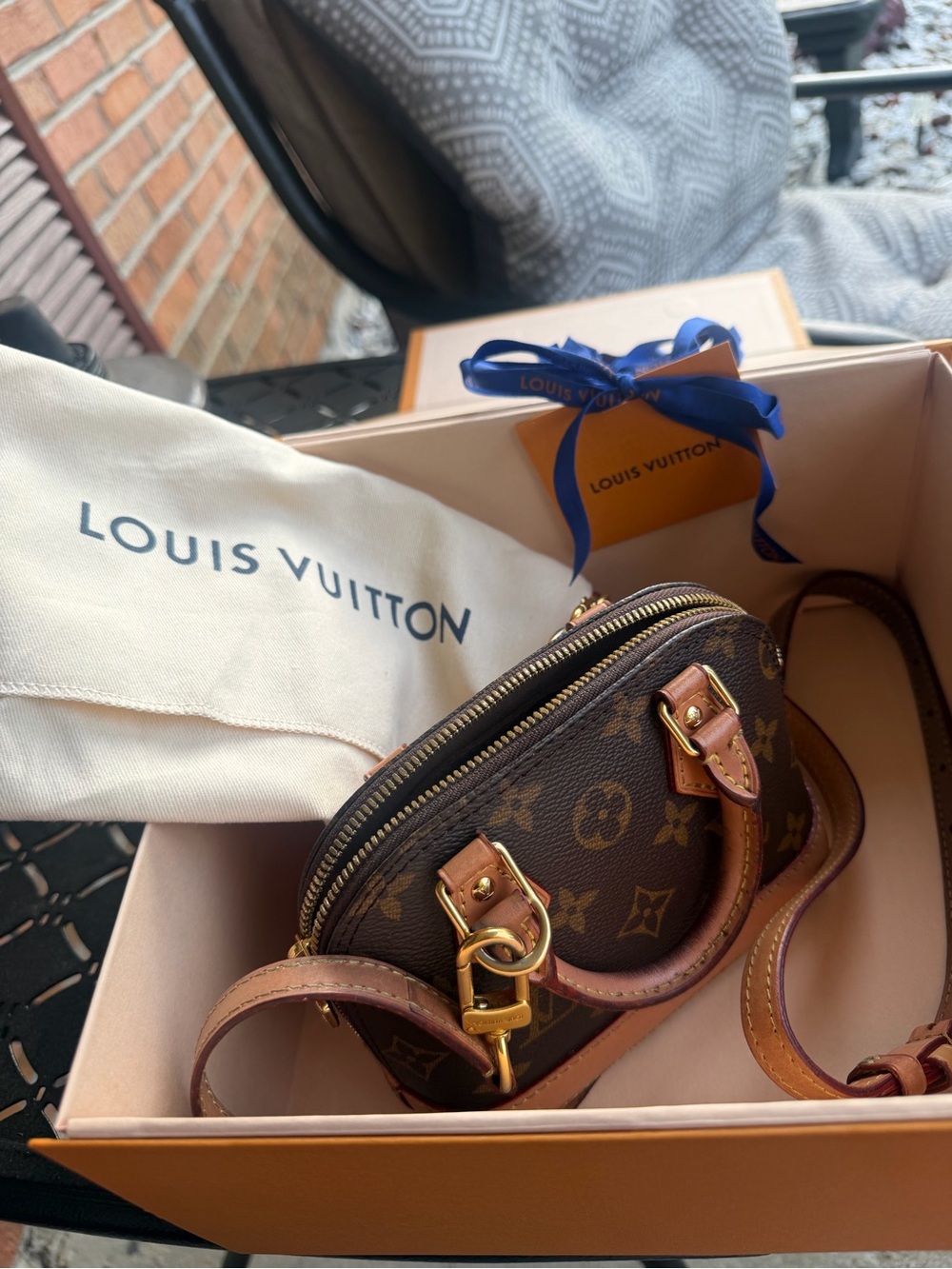 Louis Vuitton Monogram Mini Alma Pochette in Brown with Gold Hardware